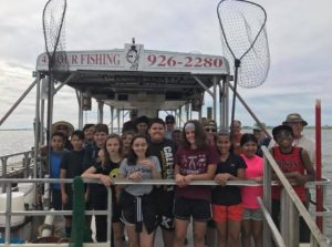Sixth grade students prepare to embark on an educational trawling trip with their teachers and biologists aboard the Duke O Fluke charter vessel in Somers Point.